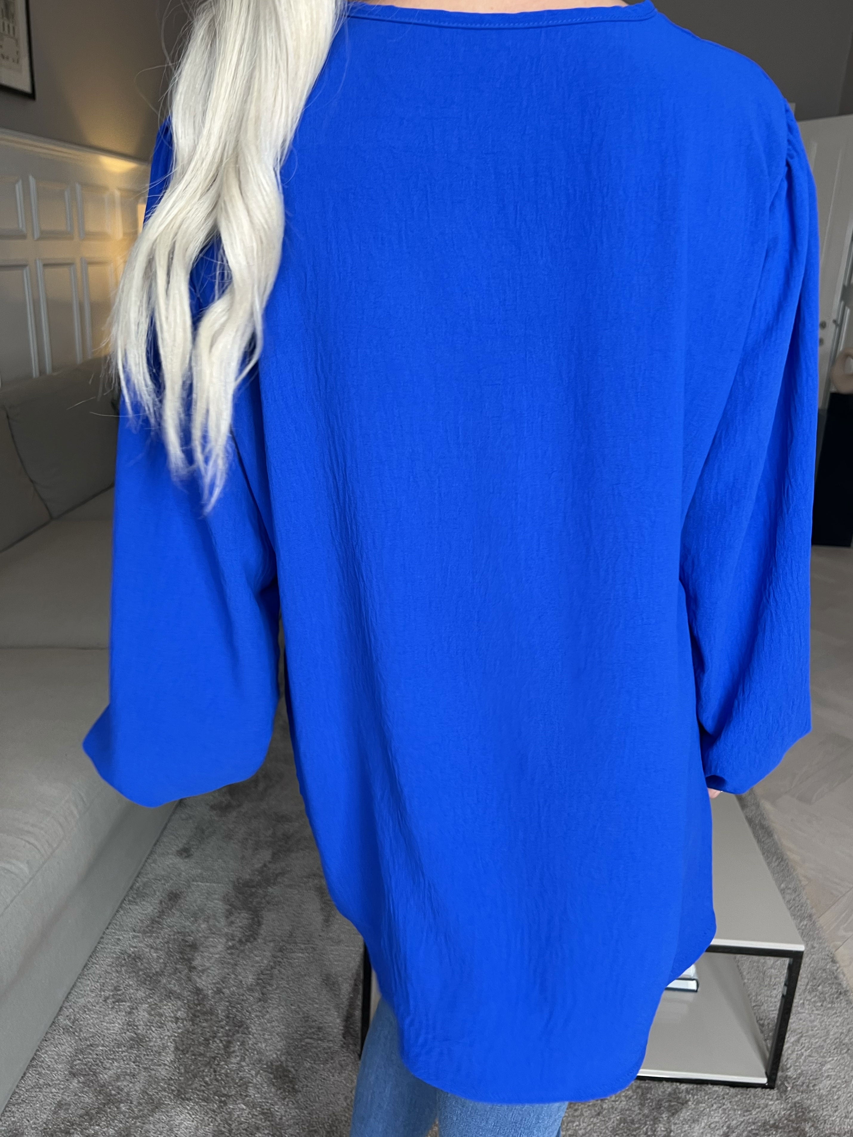 Cassandra - Söt tunika med rosett på bröstet